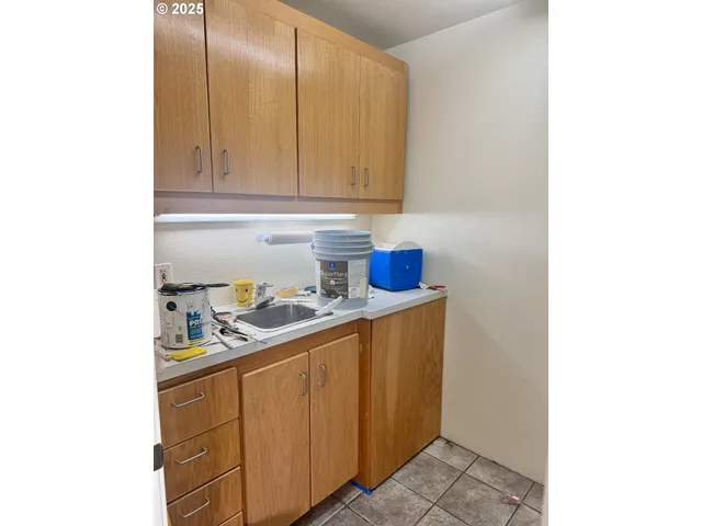 a kitchen with stainless steel appliances granite countertop a sink and cabinets