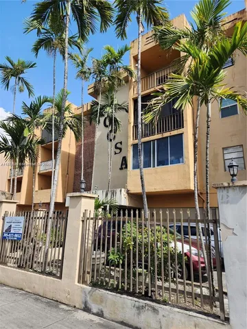 a view of a house with a tree
