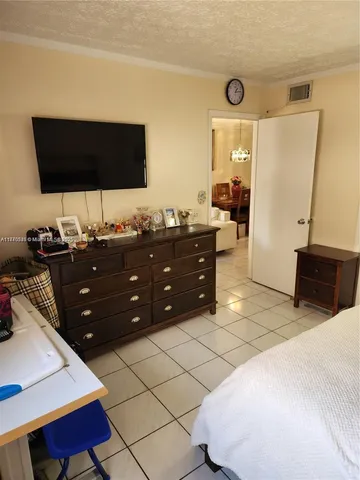 a living room with a couch and a flat screen tv