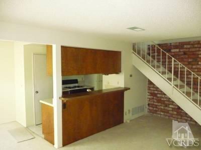 2603 Rudder Avenue Port Hueneme, CA 93041 - Photo 2 of 6 a view of a kitchen with wooden floor and electronic appliances
