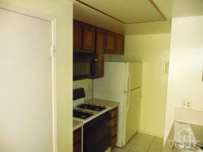2603 Rudder Avenue Port Hueneme, CA 93041 - Photo 4 of 6 a kitchen with a stove and a refrigerator