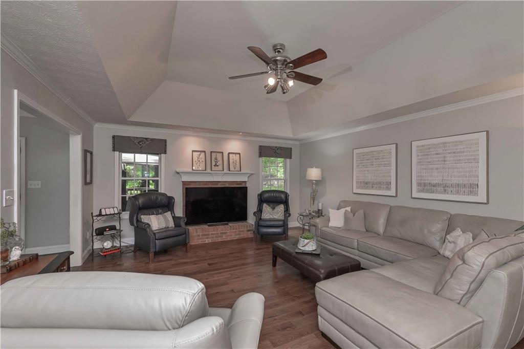 5885 West Chapel Hill Road Douglasville, GA 30135 - Photo 13 of 42 a living room with furniture a fireplace and a window