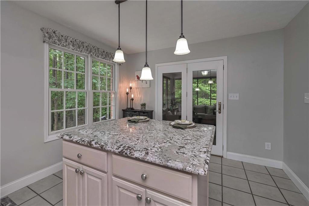 5885 West Chapel Hill Road Douglasville, GA 30135 - Photo 18 of 42 a view of a bathroom with a granite countertop sink a window and a rug
