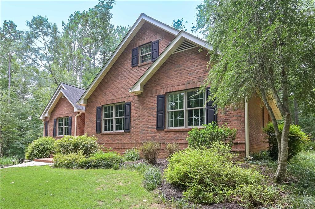 5885 West Chapel Hill Road Douglasville, GA 30135 - Photo 2 of 42 a view of a house with yard and sitting area