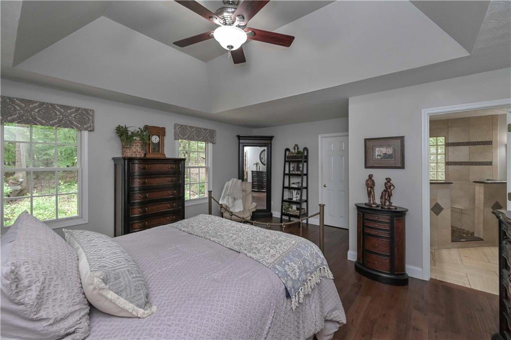 5885 West Chapel Hill Road Douglasville, GA 30135 - Photo 24 of 42 a bedroom with a bed and a large mirror