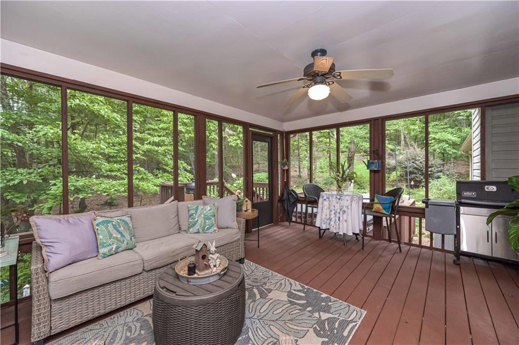 5885 West Chapel Hill Road Douglasville, GA 30135 - Photo 29 of 42 a living room with furniture and a floor to ceiling window