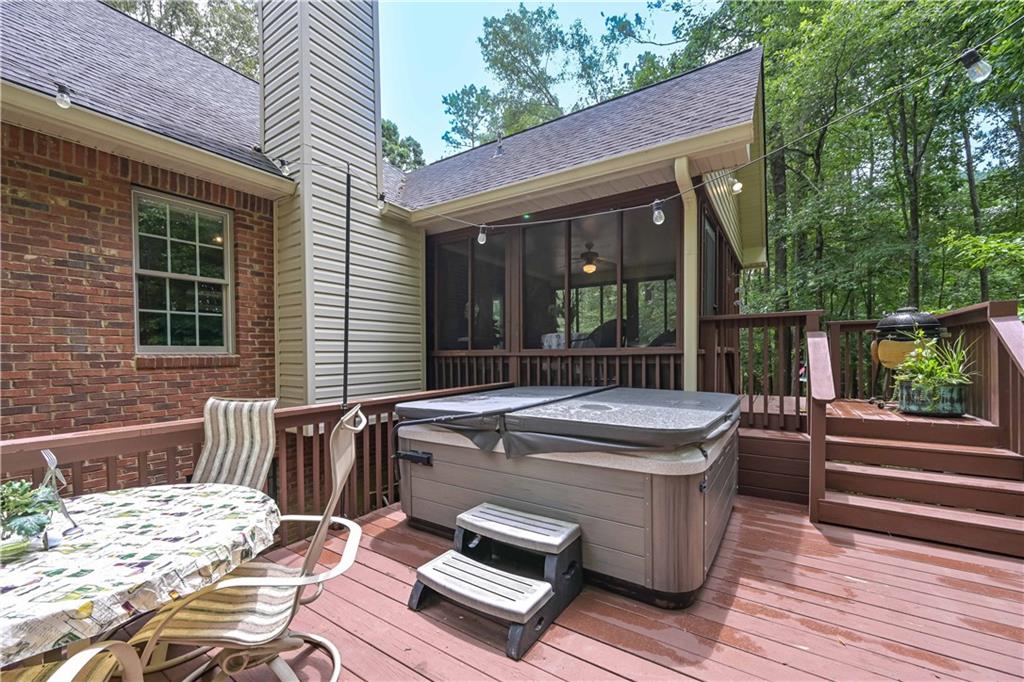 5885 West Chapel Hill Road Douglasville, GA 30135 - Photo 31 of 42 a view of a patio with a table and chairs