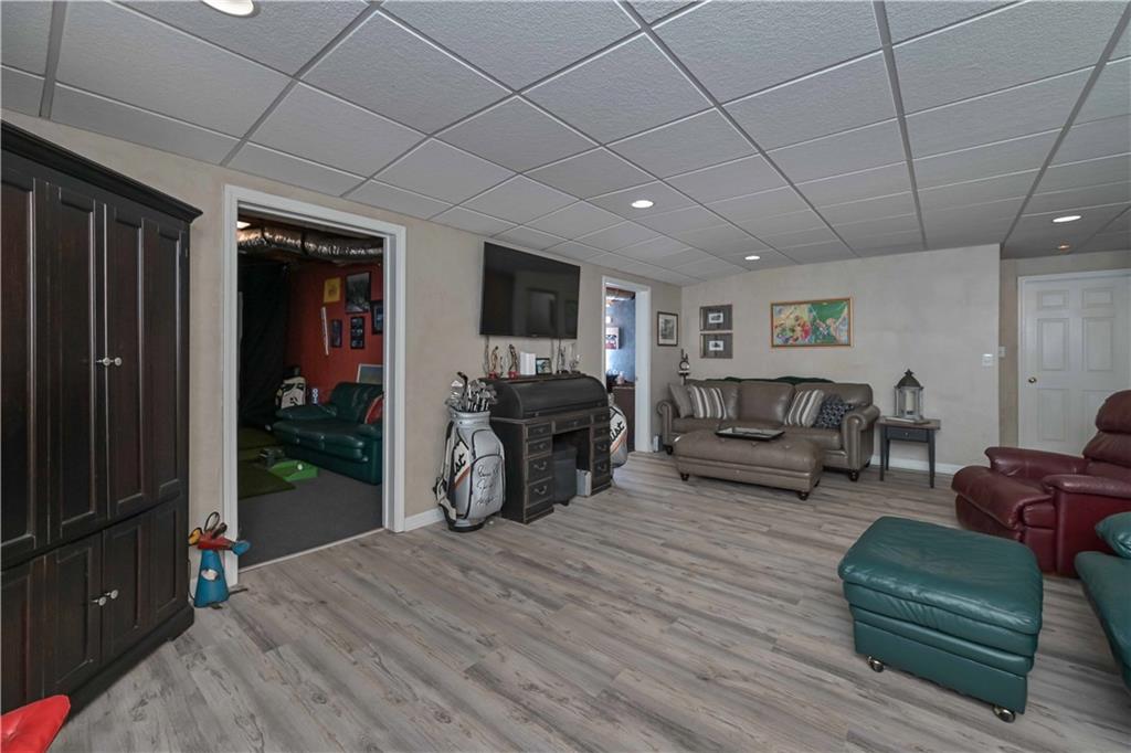 5885 West Chapel Hill Road Douglasville, GA 30135 - Photo 33 of 42 a living room with furniture a fireplace and a flat screen tv
