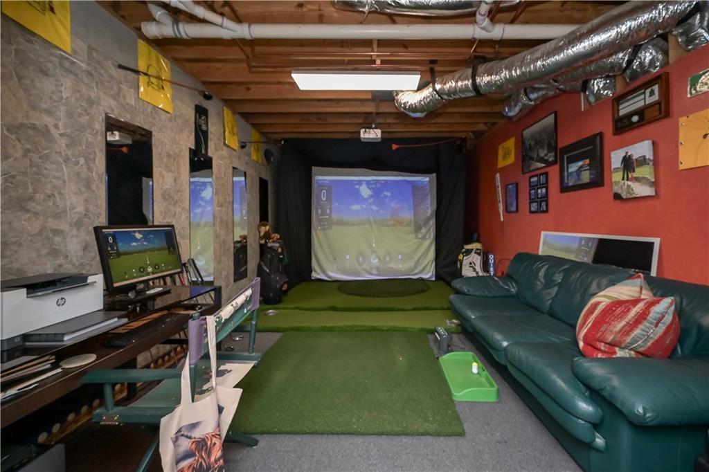 5885 West Chapel Hill Road Douglasville, GA 30135 - Photo 34 of 42 a living room with furniture and a flat screen tv