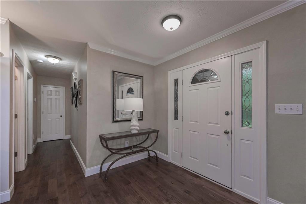 5885 West Chapel Hill Road Douglasville, GA 30135 - Photo 7 of 42 a view of room with furniture and wooden floor