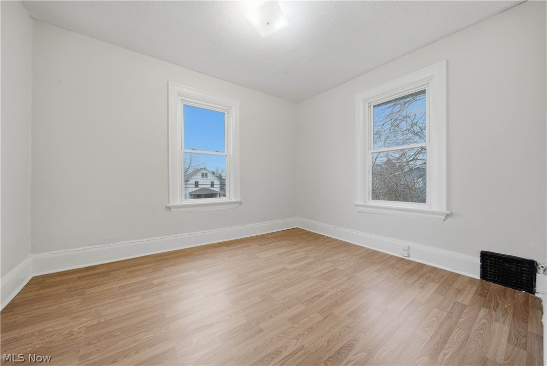 225 Cranz Place Akron, OH 44310 - Photo 21 of 34 Unfurnished room with light wood-style floors and healthy amount of natural light