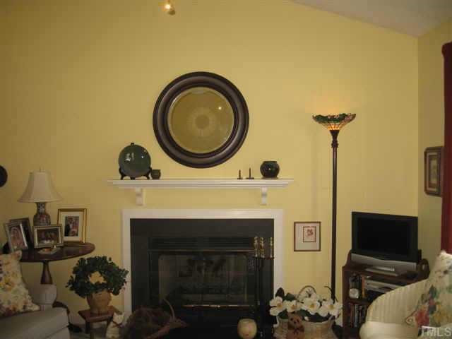 4021 Mardela Spring Drive Raleigh, NC 27616 - Photo 2 of 12 Enjoy a warm fire while relaxing in your cozy living room with vaulted ceiling. Other