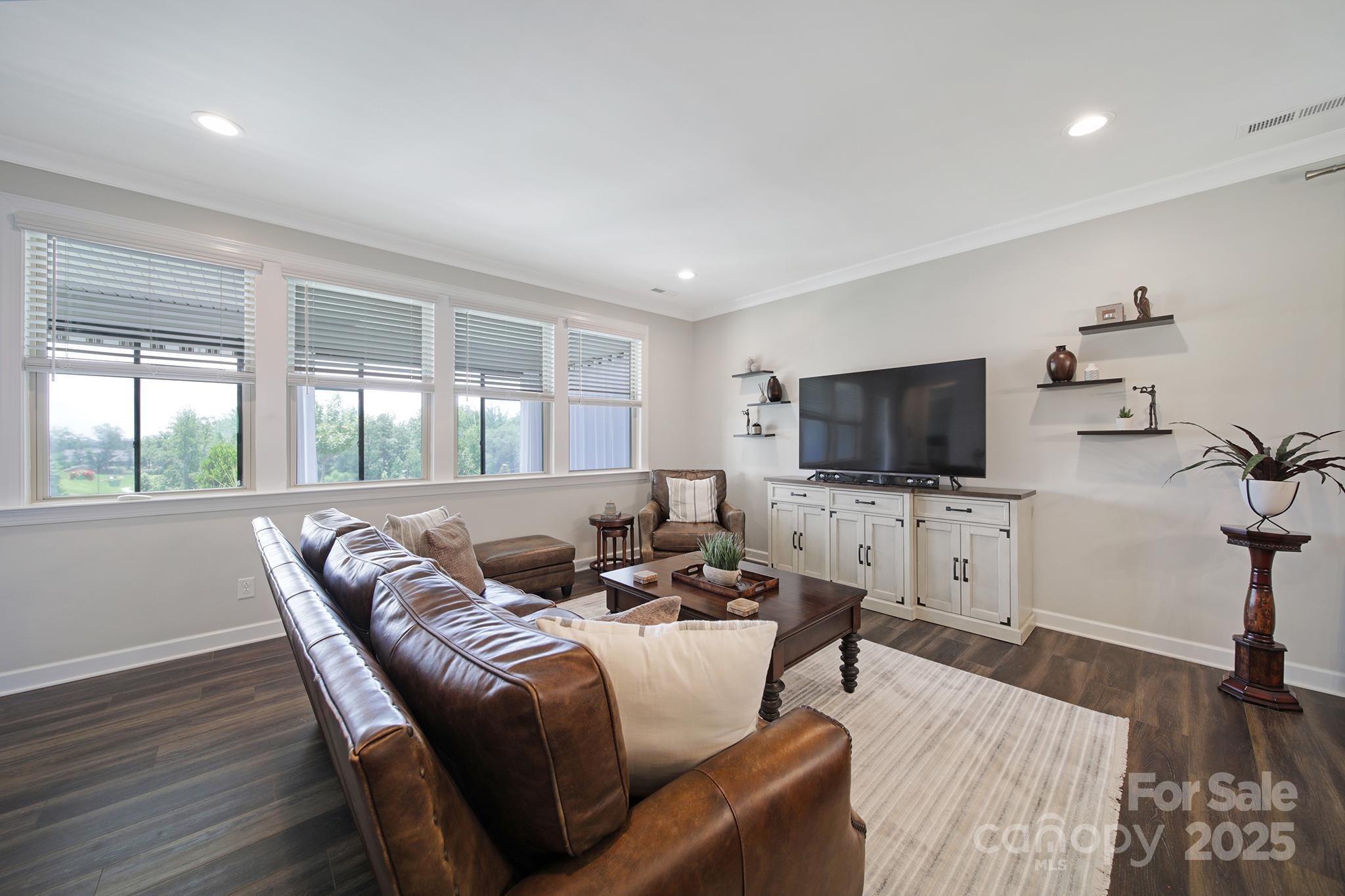 537 Lincoln Quarters Lane Fort Mill, SC 29708 - Photo 15 of 42 a living room with furniture and a flat screen tv