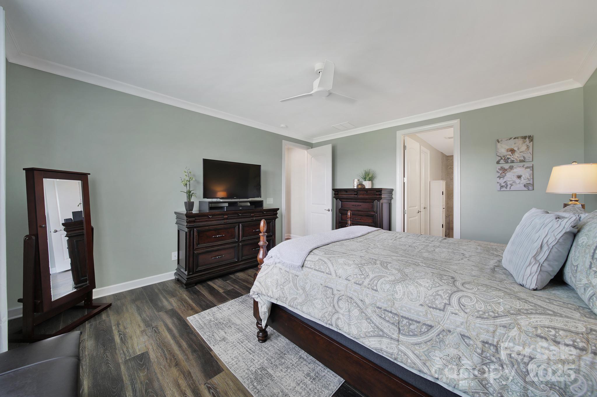 537 Lincoln Quarters Lane Fort Mill, SC 29708 - Photo 21 of 42 a bedroom with a bed and a flat screen tv