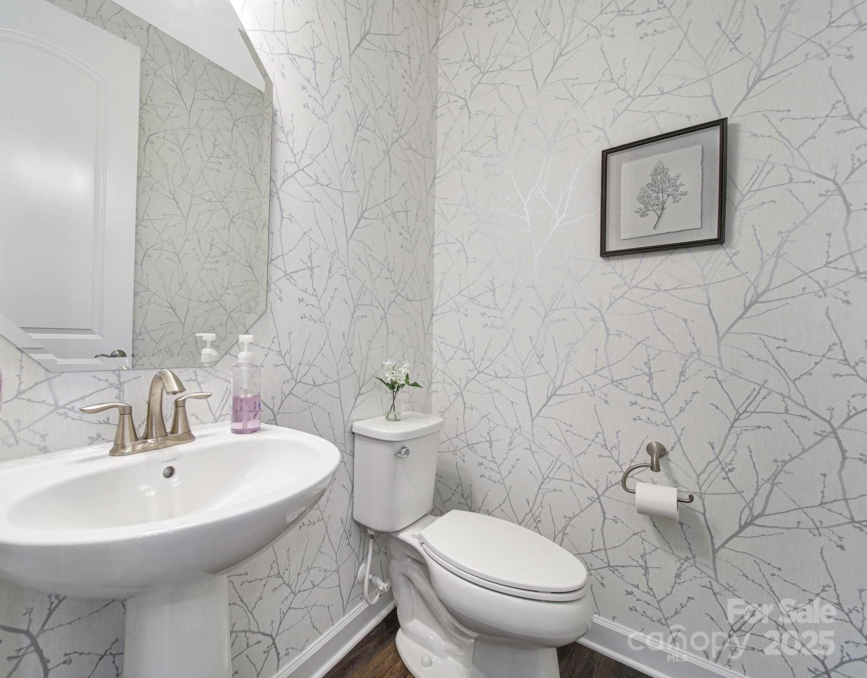537 Lincoln Quarters Lane Fort Mill, SC 29708 - Photo 25 of 42 a bathroom with a toilet sink and mirror