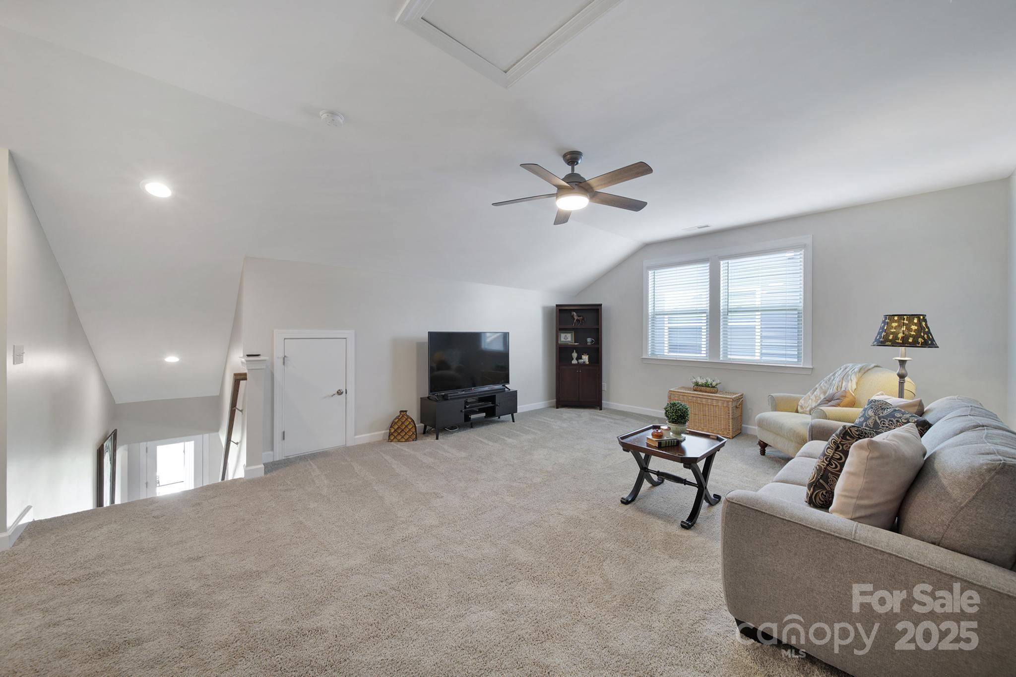 537 Lincoln Quarters Lane Fort Mill, SC 29708 - Photo 27 of 42 a living room with furniture and a flat screen tv