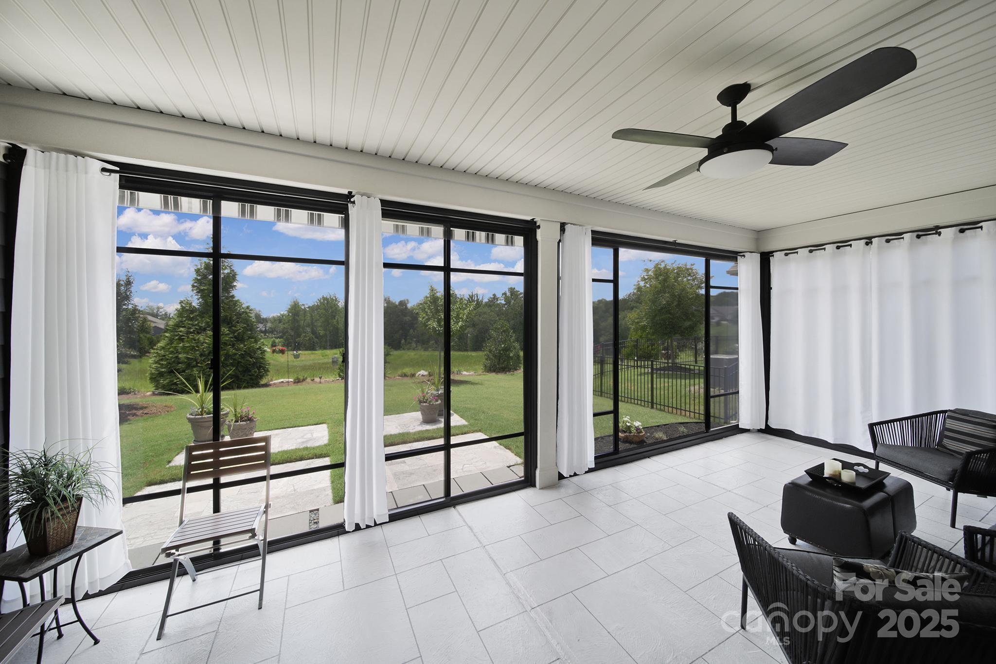 537 Lincoln Quarters Lane Fort Mill, SC 29708 - Photo 4 of 42 a living room with furniture and a floor to ceiling window