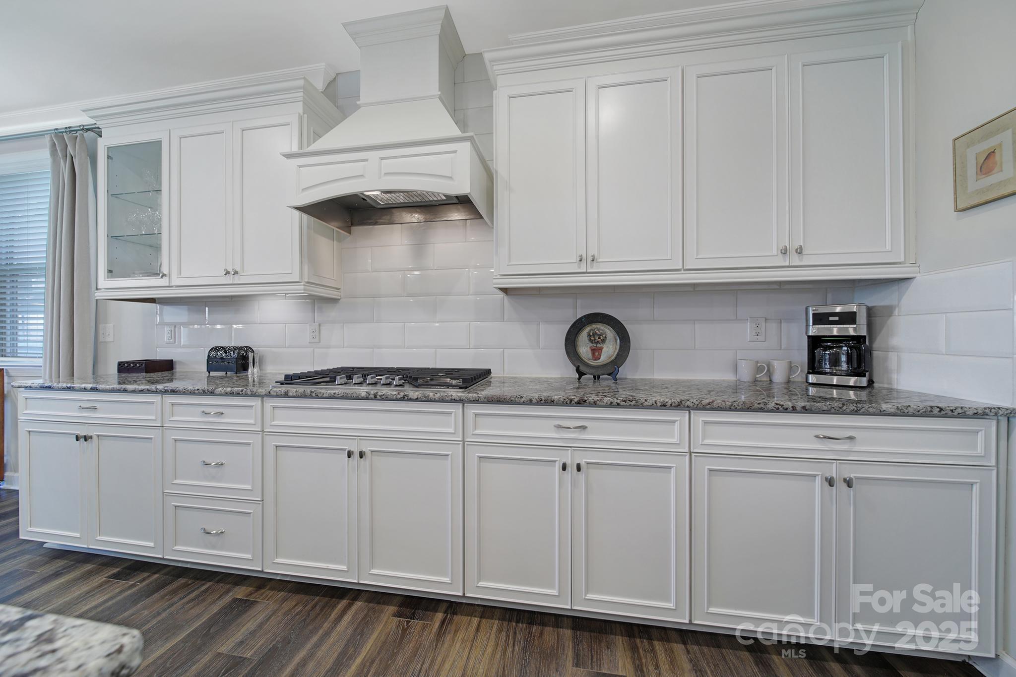 537 Lincoln Quarters Lane Fort Mill, SC 29708 - Photo 5 of 42 a kitchen with granite countertop white cabinets and white appliances