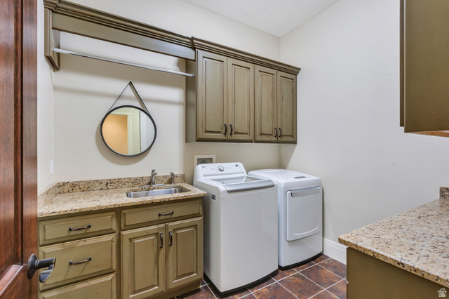 650 East Center Street Alpine, UT 84004 - Photo 22 of 38 Spacious utility room featuring granite countertops, a stainless steel utility sink, distressed-finish cabinetry, and overhead storage with a hanging rod