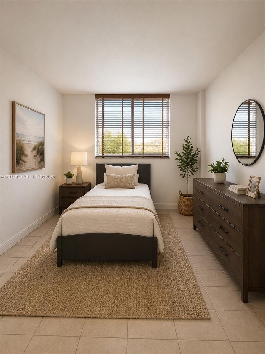 14170 Southwest 84th Street, Unit 404F Miami, FL 33183 - Photo 5 of 18 a bedroom with a large bed and windows