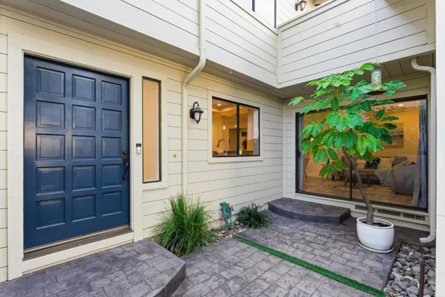 a front view of a house with garden