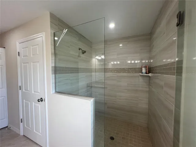 a view of a bathroom from a hallway