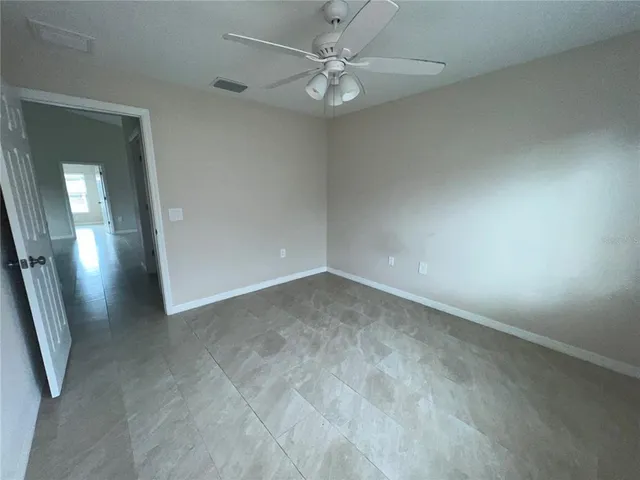 an entryway door with a hallway in a house