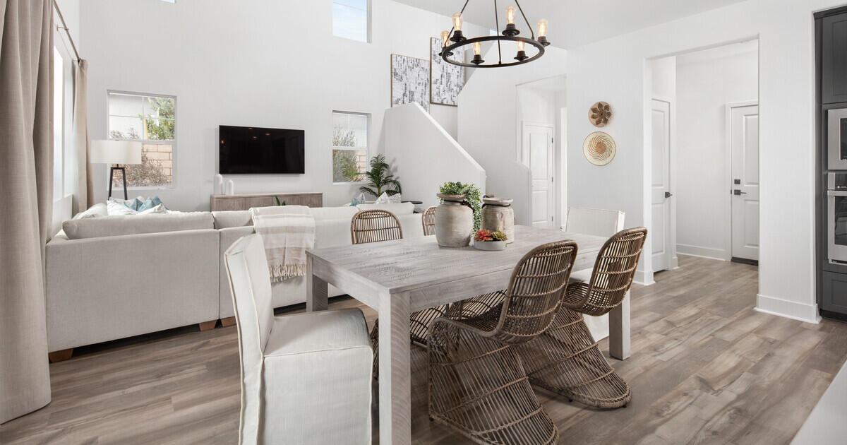 42401 Lamporo Way Indio, CA 92203 - Photo 3 of 15 a view of a dining room with furniture wooden floor and chandelier