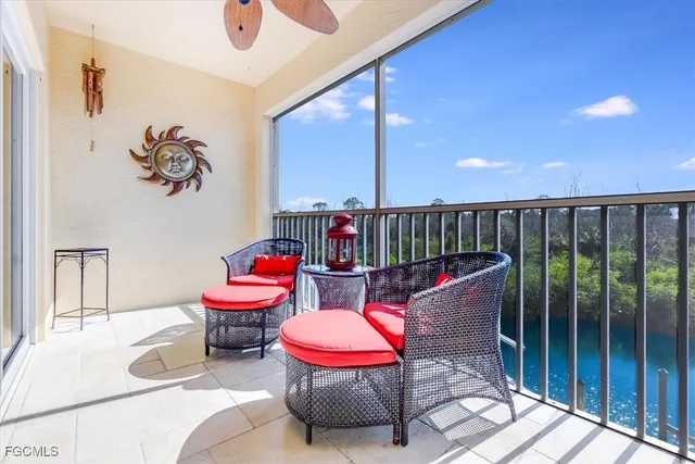 a living room with furniture a rug and a painting