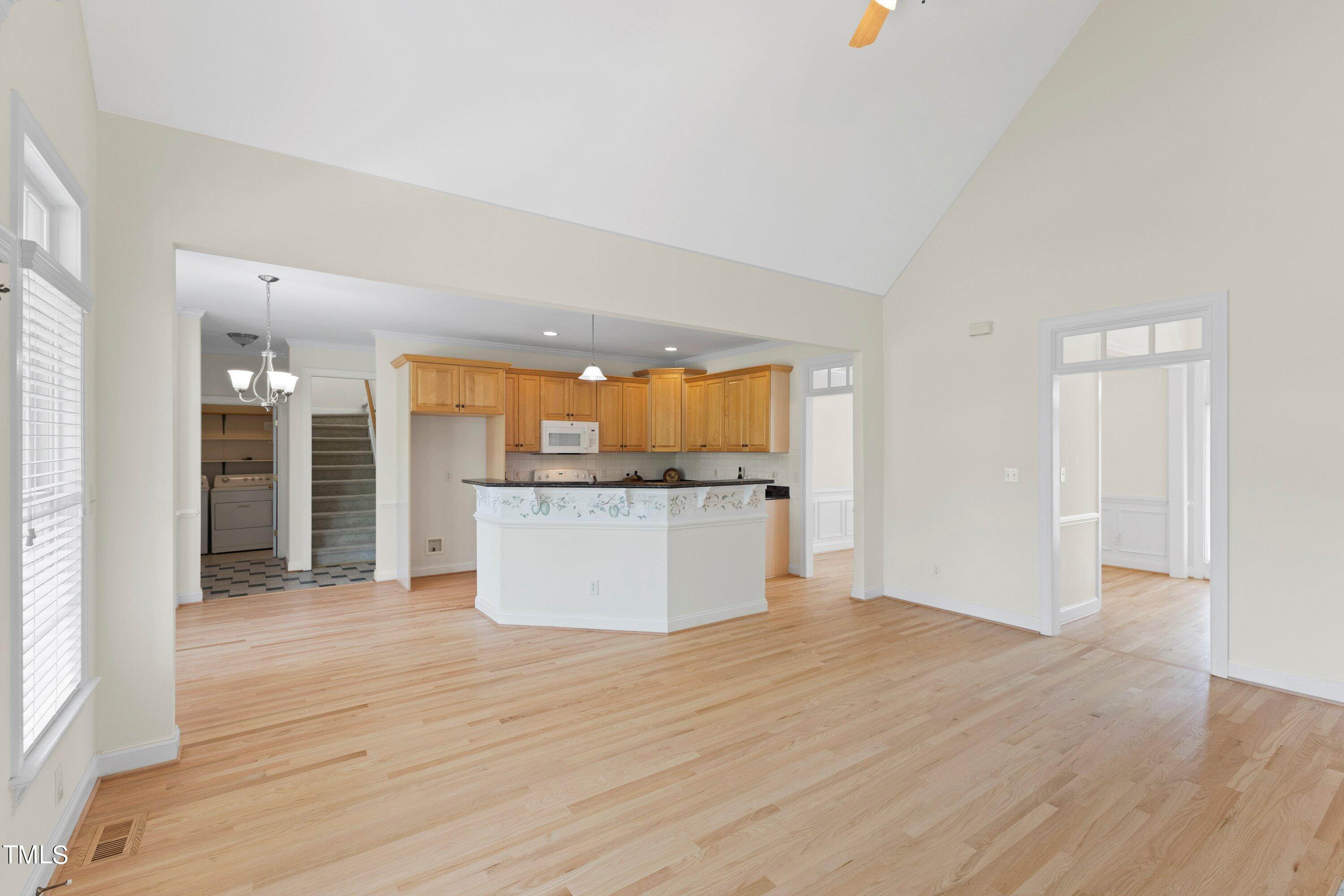 1004 Pasture View Lane Raleigh, NC 27603 - Photo 12 of 48 A picture while standing in the family room looking out to the kitchen and breakfast room. Very open and flowing plan.
