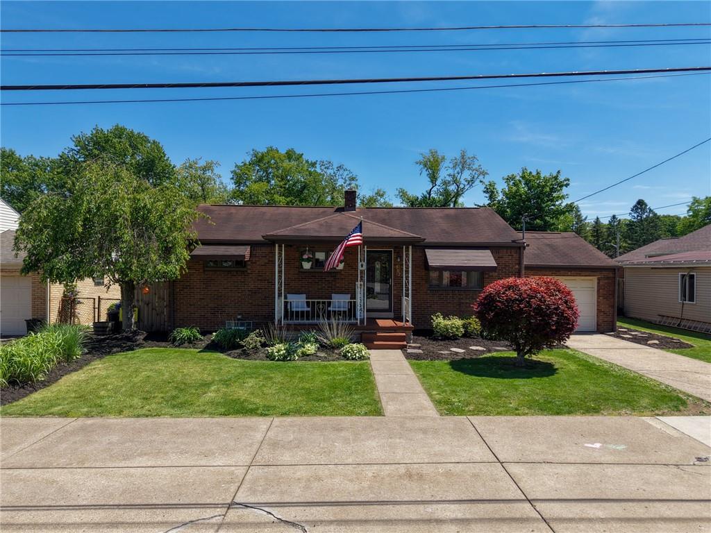 Level entry ranch with covered front porch area