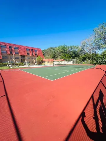 a view of a chairs and table in the patio