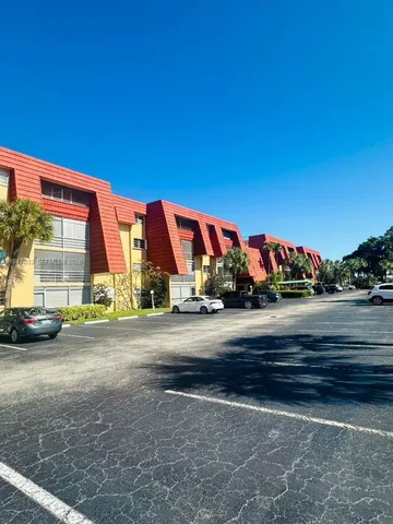 a large white bed in a white room