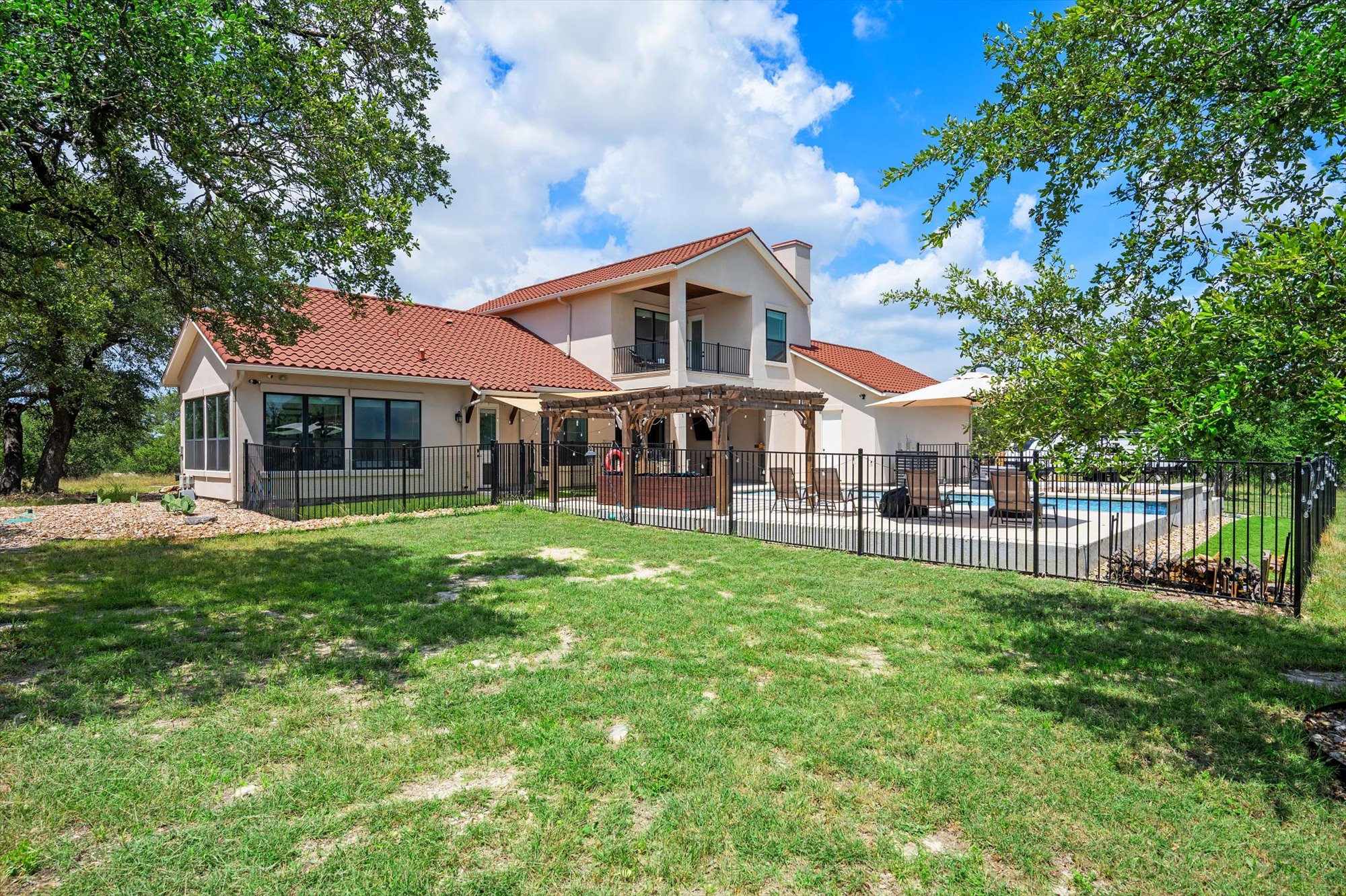 638 Strada Luca Florence, TX 76527 - Photo 6 of 38 This exquisite home offers an inviting backyard oasis with a refreshing pool, spa, and a charming pergola for outdoor enjoyment.