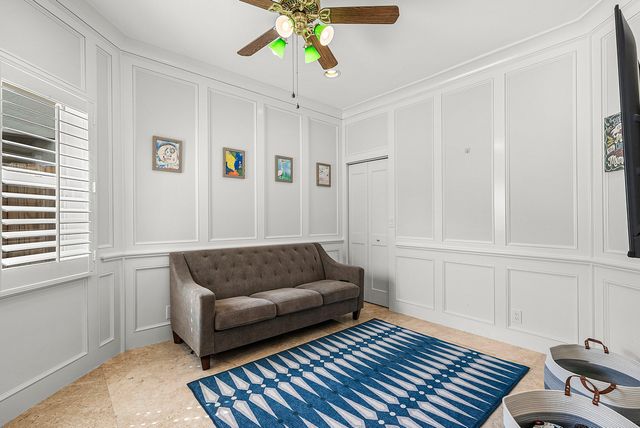 a living room with furniture and a rug