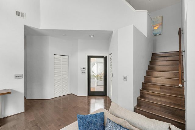 a view of entryway with wooden floor