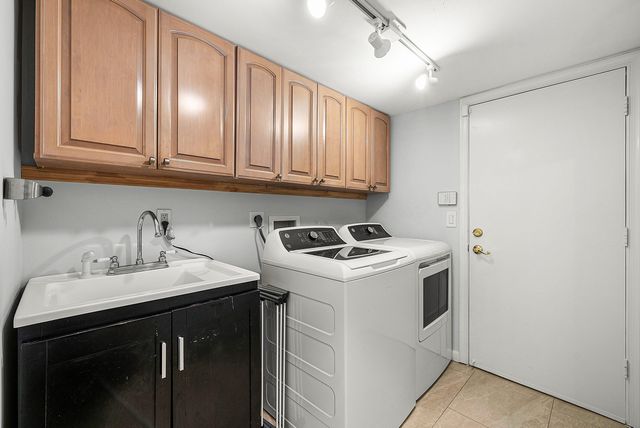 a view of a backyard with a small cabin and entertaining space