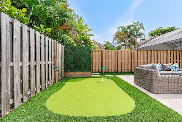 a view of a patio with a table and chairs
