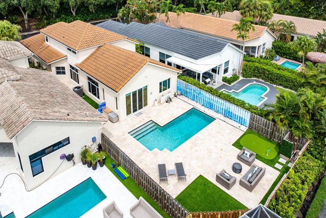 a view of a swimming pool with an outdoor space and seating area