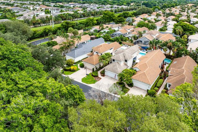 a living room with furniture and dining table with wooden floor
