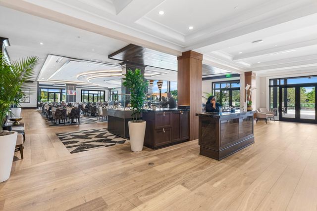 a view of a swimming pool with a patio and a garden