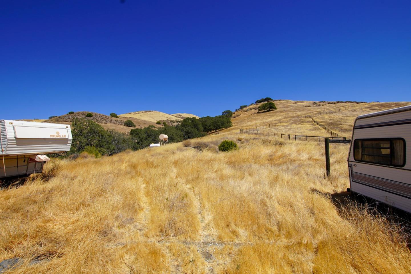 19967 Panoche Road Paicines, CA 95043 - Photo 13 of 33 a view of a dry yard with wooden fence