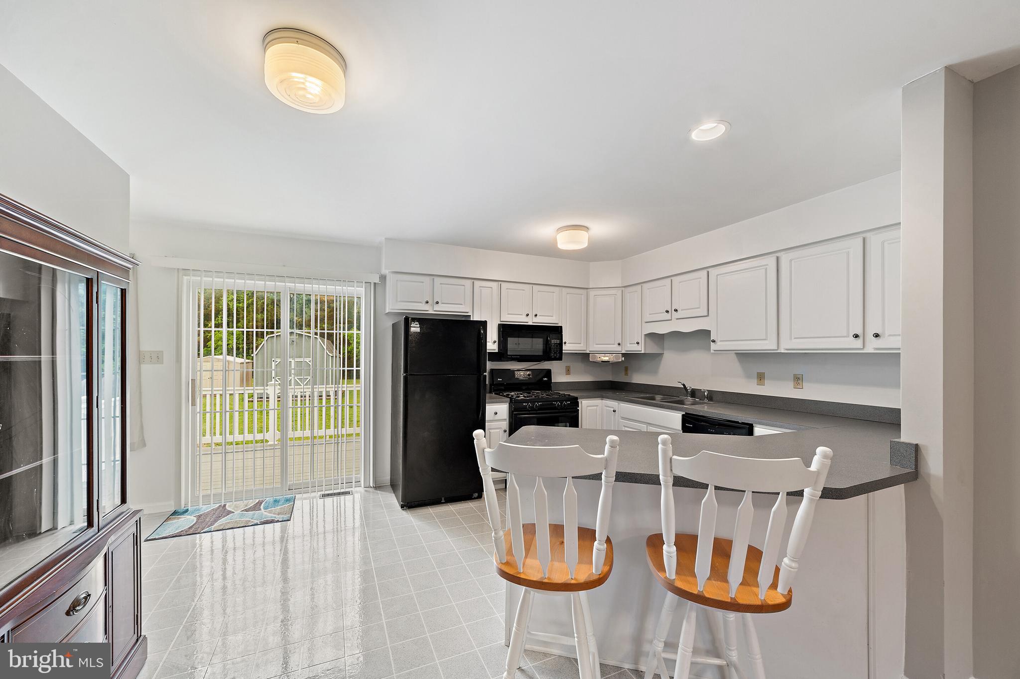 302 North Duey Road Remington, VA 22734 - Photo 9 of 34 Kitchen w/breakfast counter, new stools & floor