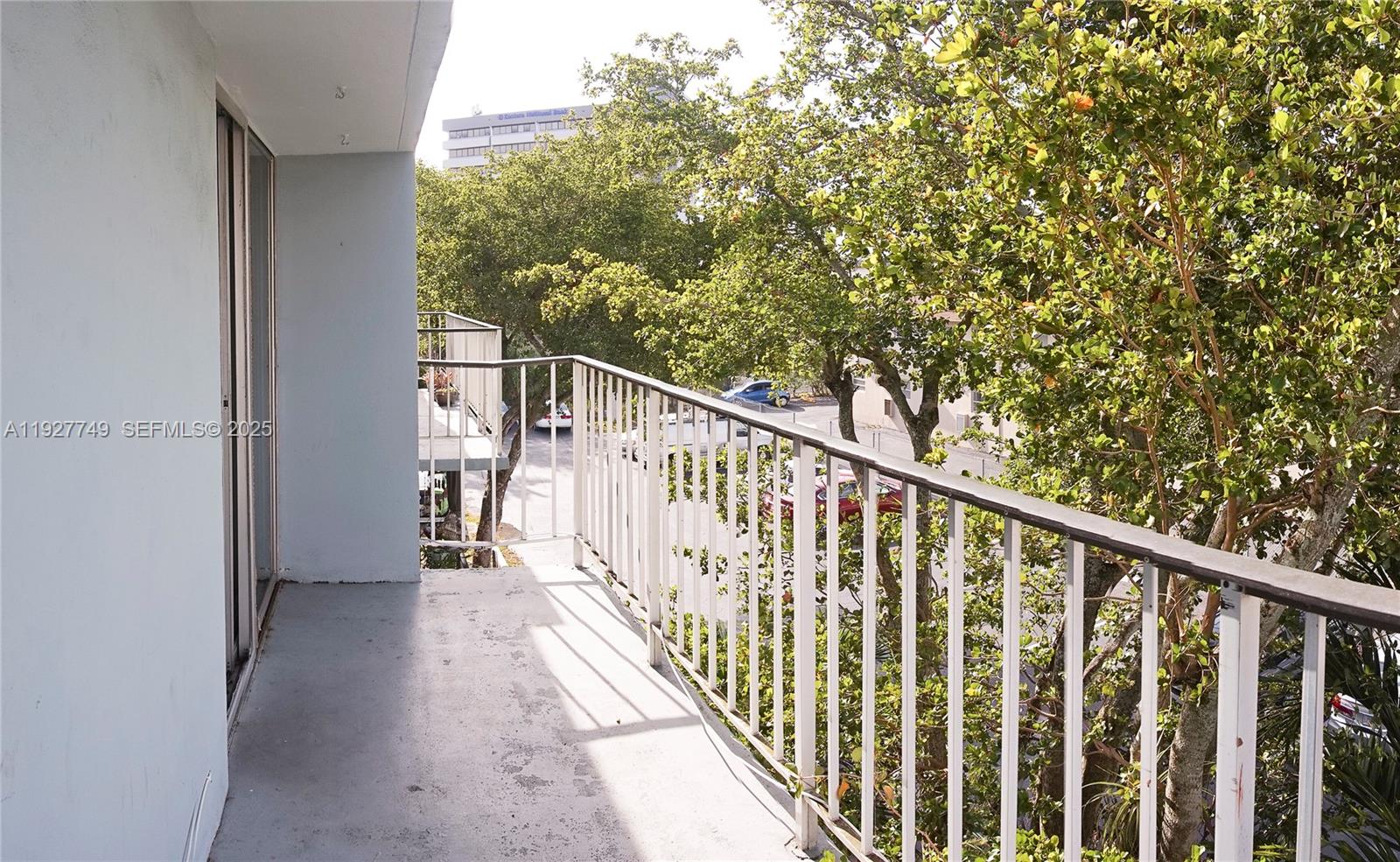 9651 Southwest 77th Avenue, Unit 304E Miami, FL 33156 - Photo 9 of 19 a view of balcony