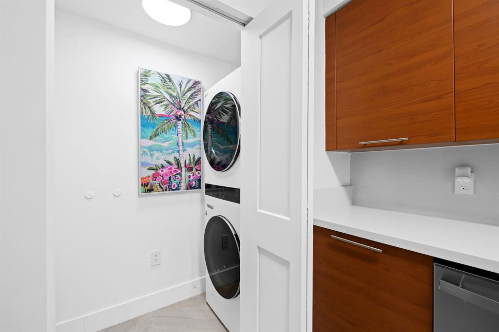 350 Southeast 2nd Street, Unit 2280 Fort Lauderdale, FL 33301 - Photo 11 of 25 a view of washer and dryer with kitchen in the background