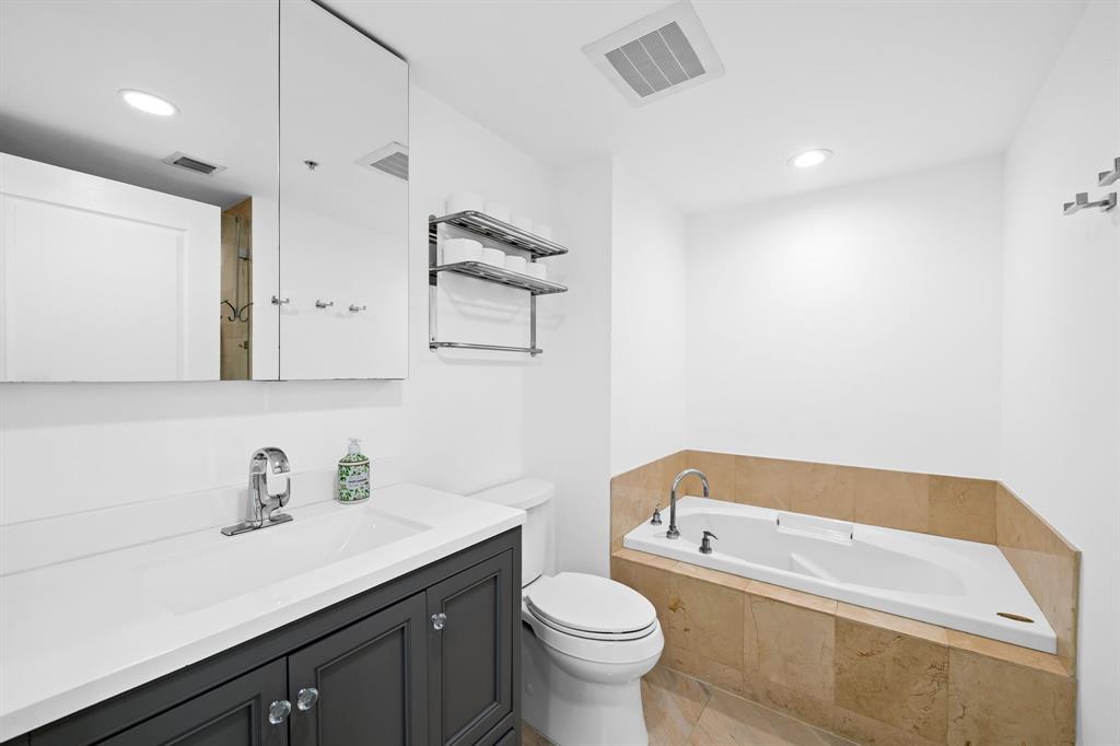 350 Southeast 2nd Street, Unit 2280 Fort Lauderdale, FL 33301 - Photo 12 of 25 a bathroom with a sink a toilet and a bathtub