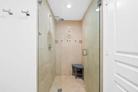 a bathroom with a shower and a sink