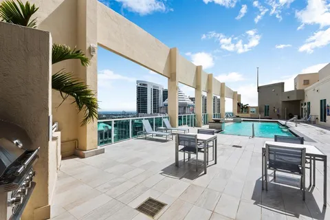 a patio with a table and chairs