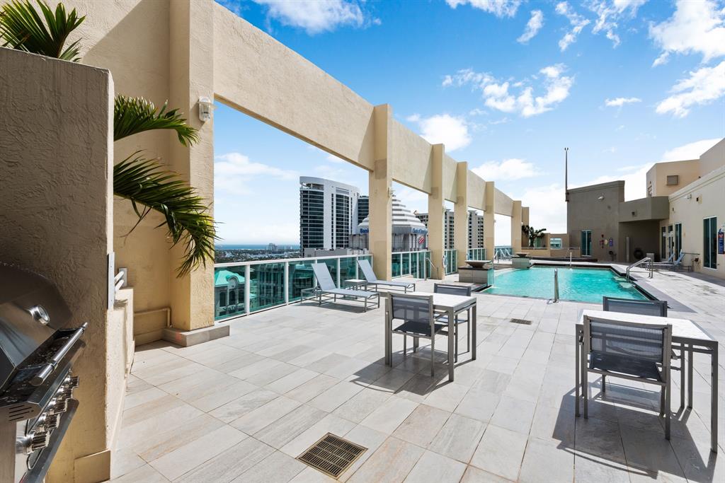 350 Southeast 2nd Street, Unit 2280 Fort Lauderdale, FL 33301 - Photo 2 of 25 a patio with a table and chairs