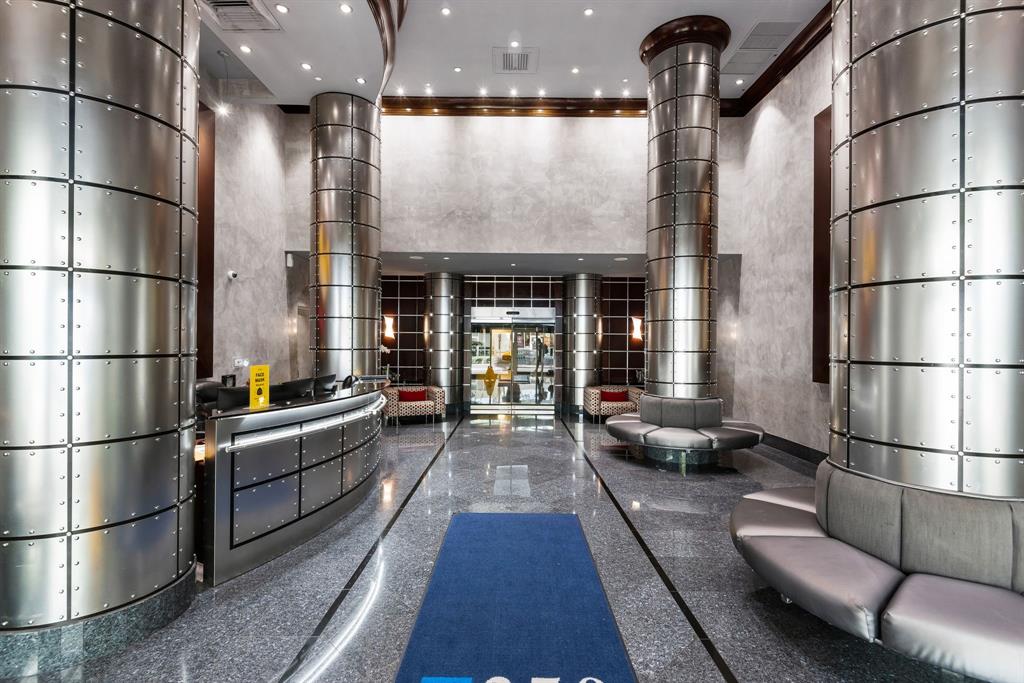 350 Southeast 2nd Street, Unit 2280 Fort Lauderdale, FL 33301 - Photo 21 of 25 a kitchen with stainless steel appliances granite countertop a refrigerator and a view of living room